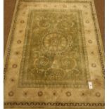 Persian design pale green ground rug,