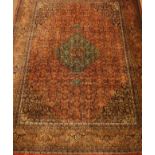 Persian Bijar style red ground rug carpet, repeating herati motif with blue medallion,