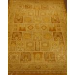 Large Persian Bakhtiari style yellow ground rug carpet, panelled garden design decorated with urns,