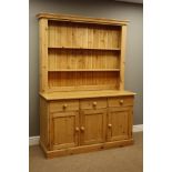 Waxed pine kitchen dresser, three drawers above three cupboards, raised plate rack, W138cm, H191cm,