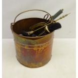 19th century riveted copper coal bin with swing handle and later brass fire irons,