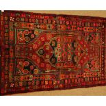 Persian Hamadan plumb ground rug, central lozenge with stylised geometric motifs,