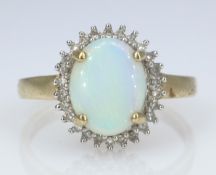 Opal and diamond gold cluster ring hallmarked 9ct Condition Report size P-Q 2.