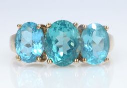 Gold three stone apatite ring stamped 9K Condition Report Approx 3.