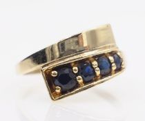 Contemporary sapphire cross-over gold ring hallmarked 9ct Condition Report size O 3.