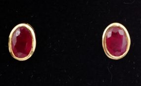 Pair of ruby gold rim set ear-studs stamped 9K Condition Report <a href='//www.