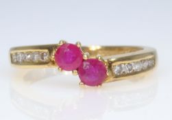 18ct gold two stone ruby and ten stone diamond ring hallmarked Condition Report