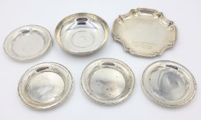 Four Egyptian silver coasters,