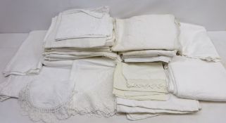 Two boxes containing table linen, embroidered table cloths,