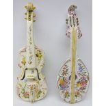 Two 19th century Faience wall pockets in the form of musical instruments; violin & lute,