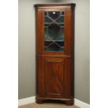 19th century mahogany floor standing corner cupboard, glazed upper and panelled lower doors,