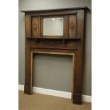 1940s medium oak fireplace surround, bevelled mirror back, applied rope twist moulding, W138cm,