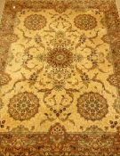 Large rug carpet, decorated with scrolling foliage and flower head motifs,