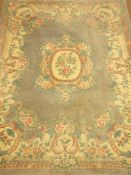 Large Chinese washed woollen rug carpet, pale blue ground with traditional floral design,