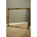 Large bevelled edge wall mirror in swept gilt frame,