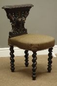 Late 19th century oak reading chair, carved with hound mask and foliage, barley twist supports,