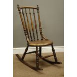 Victorian bentwood rocking chair with spindle turned back and moulded seat, on turned supports,
