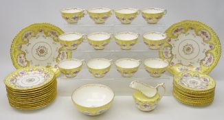 Early 20th Century Coalport tea service painted with floral bouquets against a lemon border,