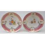 Pair 20th century Austrian chargers, decorated with cherubs and figures on pink ground,
