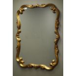 Rococo style scrolled gilt framed wall mirror,