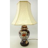 Japanese style pottery baulster shaped table lamp in the Imari pallet, with shade,