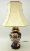 Japanese style pottery baulster shaped table lamp in the Imari pallet, with shade,