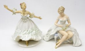 Two German Wallendorf figurines, woman seated with fan & a dancing woman,