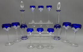 20th century Bohemian faceted glass liquor set with cobalt blue overlay, comprising pair decanters,