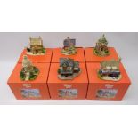 Six Lilliput Lane models; 'The Lion House', 'Sore Paws', 'Railway Cottage', 'The Pineapple House',