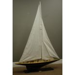 Wooden model of a yacht on stand with a metal plaque reading 'Endeavour', L112cm, W20cm,