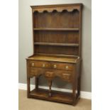 Small 17th century style oak dresser with plate rack, two drawers and three small spice drawers,