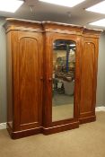 Victorian mahogany triple wardrobe, centre mirror glazed door, two arched panelled doors,