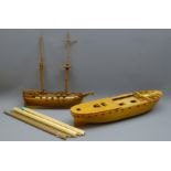 Two wooden 1:46 approx scale part finished kit models, one of a twin masted cargo ship,