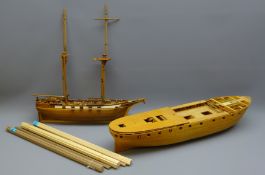 Two wooden 1:46 approx scale part finished kit models, one of a twin masted cargo ship,