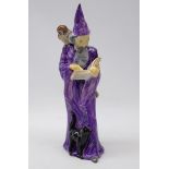 Royal Doulton figure 'The Wizard' having a purple cloak, modelled by A. Maslankowski, HN 2877, H25.