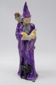 Royal Doulton figure 'The Wizard' having a purple cloak, modelled by A. Maslankowski, HN 2877, H25.