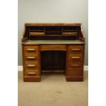 Early 20th walnut roll top desk, serpentine tambour and fitted interior above eight drawers,