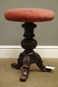 Victorian walnut revolving piano stool, turned column with three carved supports,