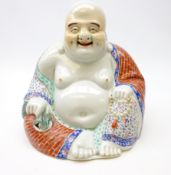 20th century porcelain figure of Hotei, seated wearing flowing robes,