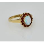 Gold opal and garnet cluster ring hallmarked 9ct Condition Report size L-M 2.