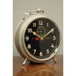 Early to mid 20th century 'Goliath Repeater' circular polished metal alarm clock,