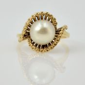 Pearl gold ring in open scroll setting tested to 9ct Condition Report size