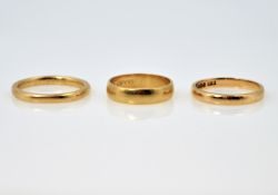 Three 22ct gold wedding bands, approx 9.5gm Condition Report <a href='//www.