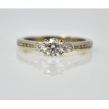 Three stone round brilliant cut diamond 18ct white gold ring,