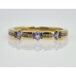 Channel set diamond and blue topaz gold ring hallmarked 9ct Condition Report size