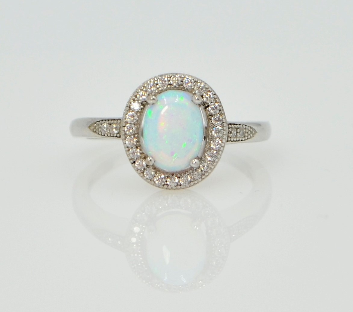 Silver opal halo dress ring stamped 925 Condition Report size M<a href='//www.