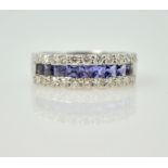 Tanzanite and diamond half eternity ring,