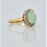 Opal and diamond gold cluster ring hallmarked 9ct Condition Report Approx 3gm size