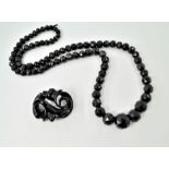 Victorian Whitby jet necklace approx 84cm & large brooch 6.