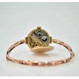 Early 20th century 9ct rose gold wristwatch, expanding gold bracelet and an 18ct gold wristwatch,